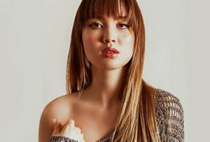 Woman with long hair with a textured mid-length fringe